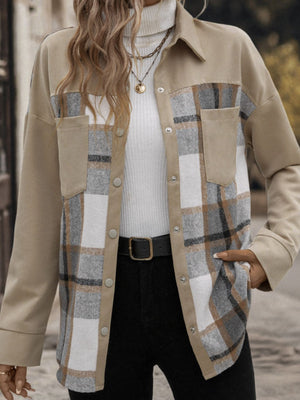 Panelled plaid shacket in tan with patch pockets and button front, styled with a white turtleneck.
