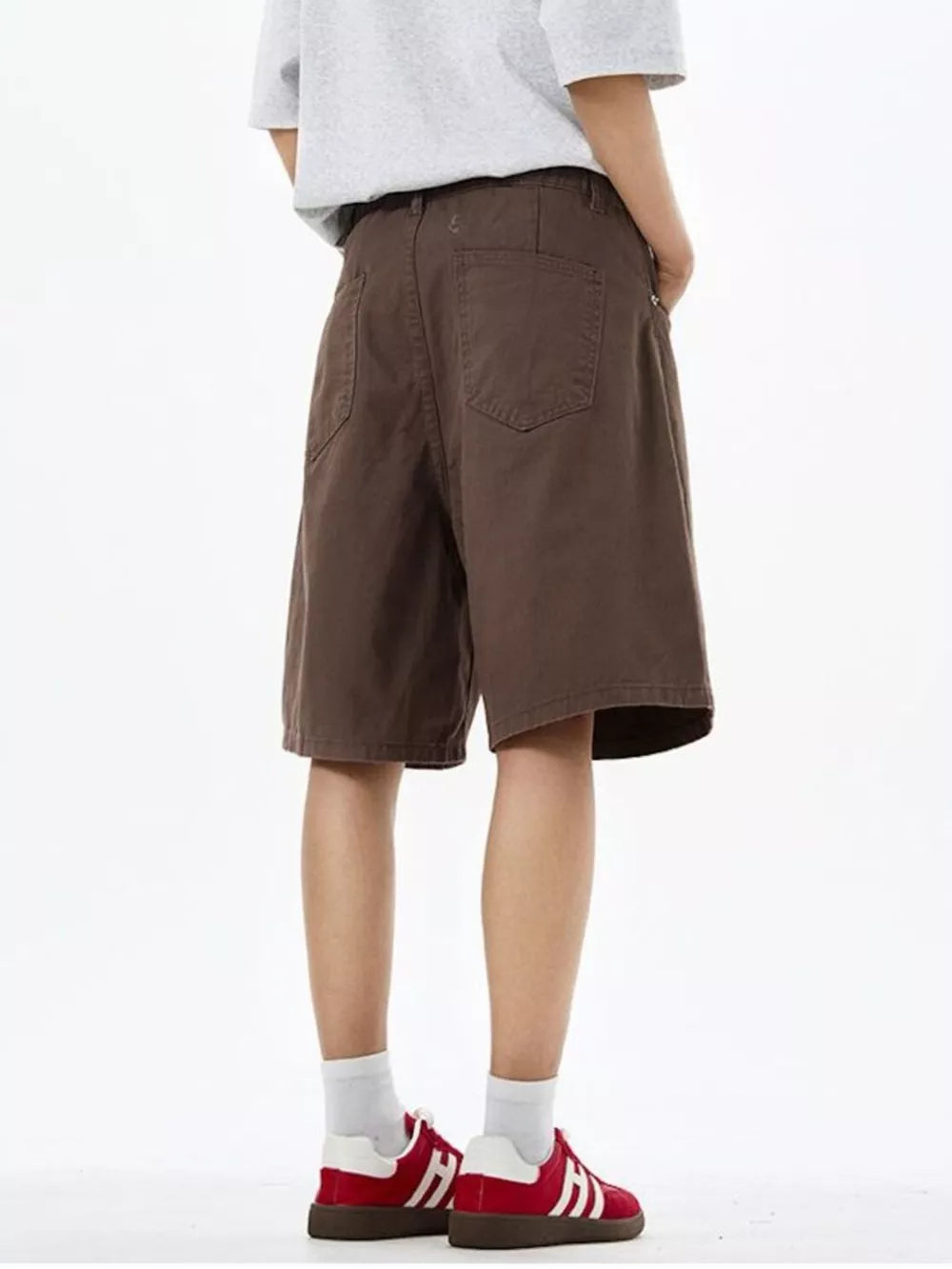 Brown chino shorts with drawstring waist and back pockets.