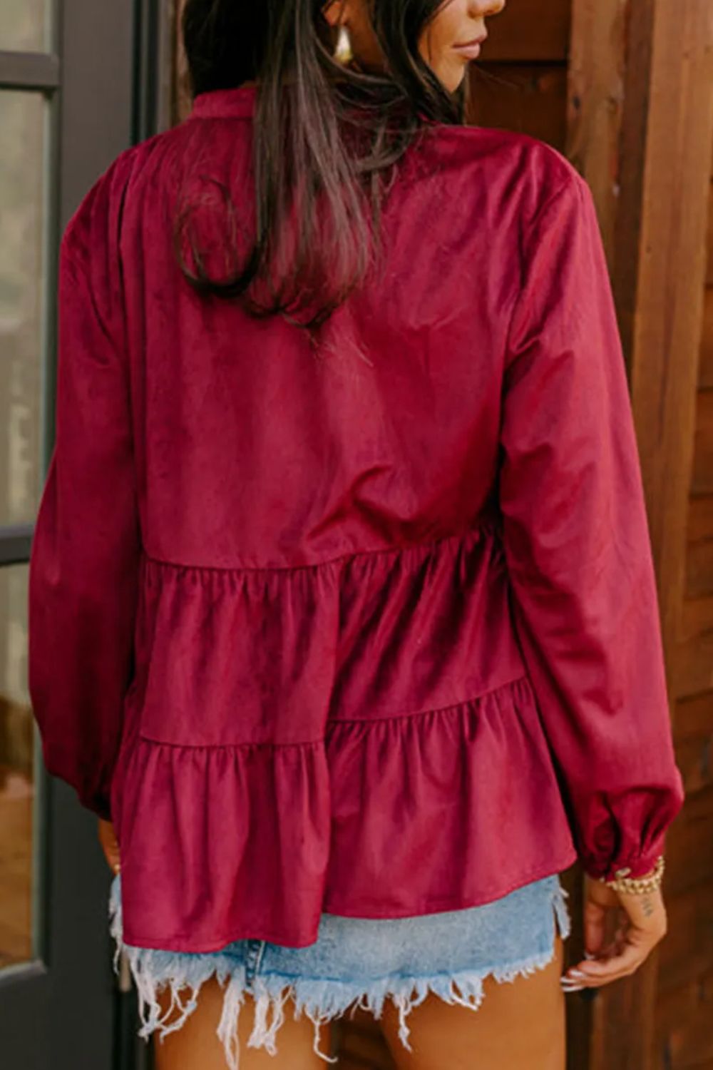 Burgundy corduroy tiered blouse with long sleeves and button details.