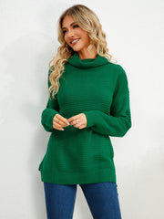 Green textured knit oversized turtleneck pullover sweater with ribbed details.