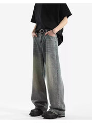 Men's vintage wash relaxed fit jeans with a baggy cut and cotton blend fabric.