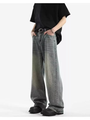 Men's vintage wash relaxed fit jeans with a baggy cut and cotton blend fabric.
