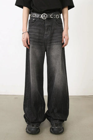 Dark balloon-leg denim jeans with subtle fade and a wide leg