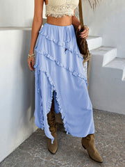 Light blue midi skirt with cascading ruffles and a high slit.