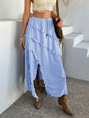 Light blue midi skirt with cascading ruffles and a high slit.