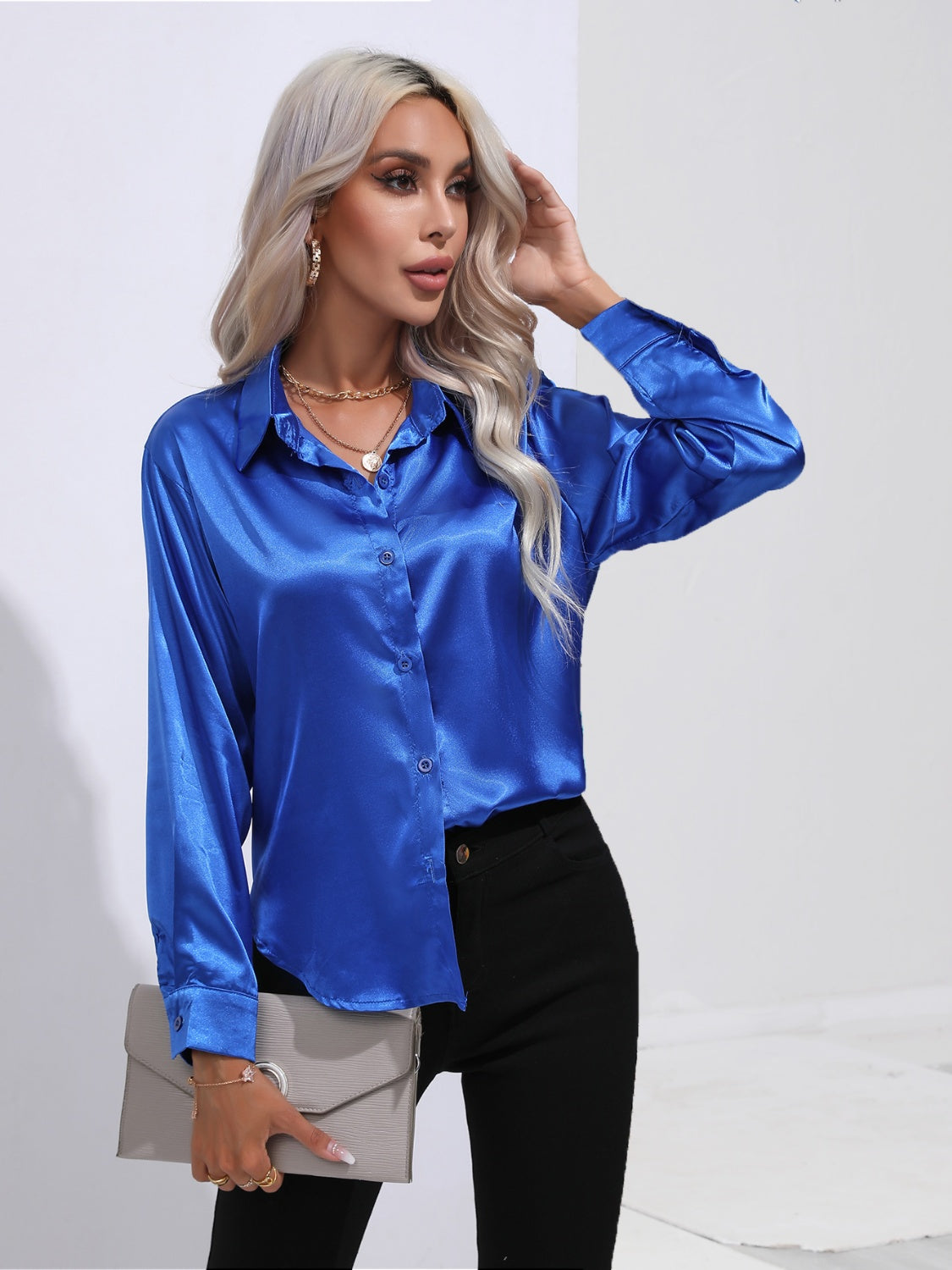 Royal blue satin tie-front blouse with button front and collar.