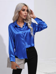 Royal blue satin tie-front blouse with button front and collar.