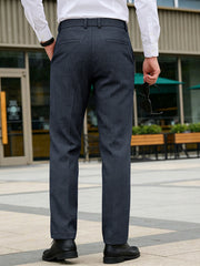 Classic fit men's dark gray dress pants with pockets and a subtle herringbone pattern.