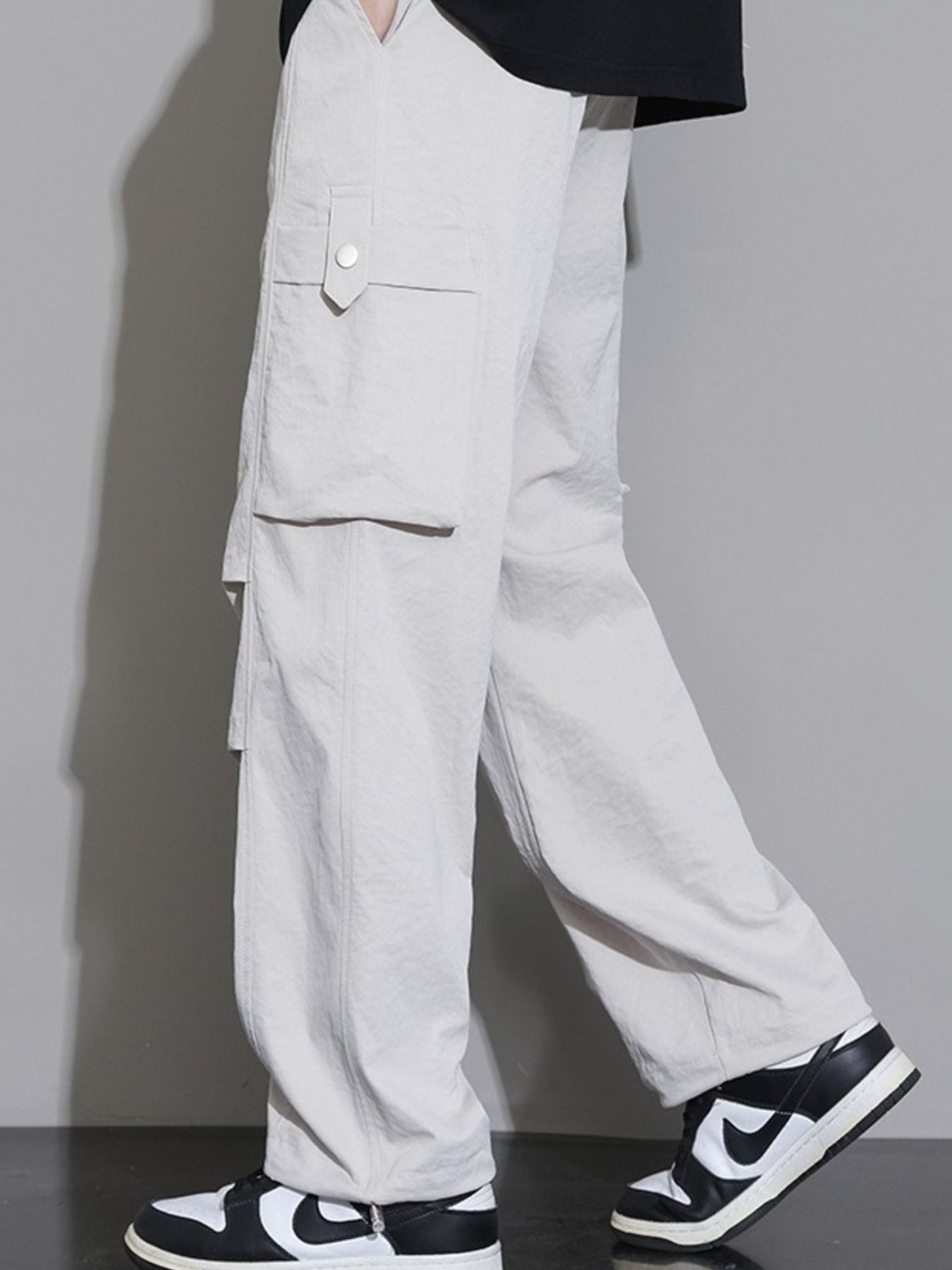 Men's relaxed fit cargo sweatpants in Dust Storm with button-flap pockets.