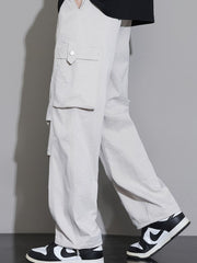 Men's relaxed fit cargo sweatpants in Dust Storm with button-flap pockets.