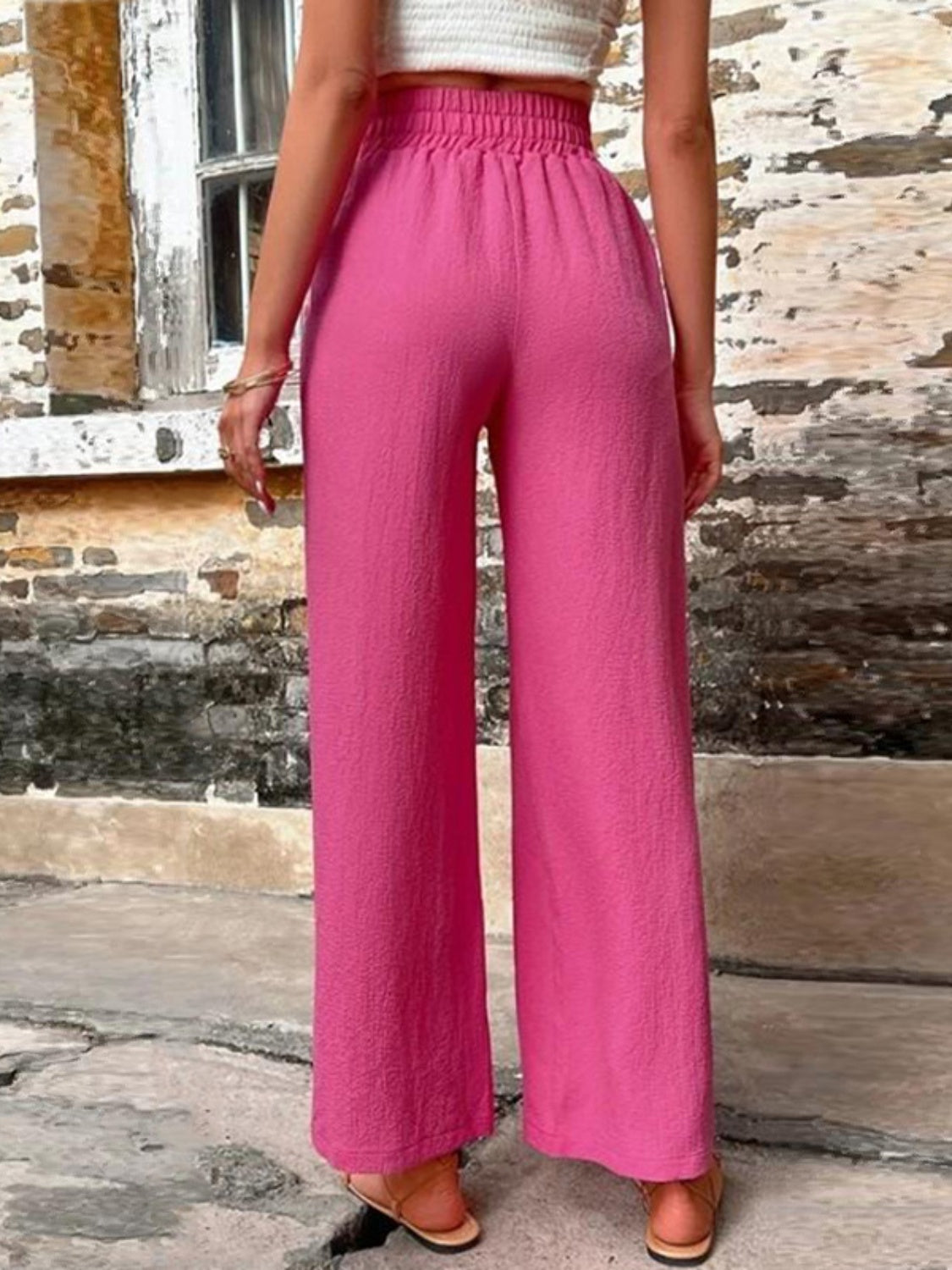 Cerise linen palazzo trousers with elastic waist and wide leg.