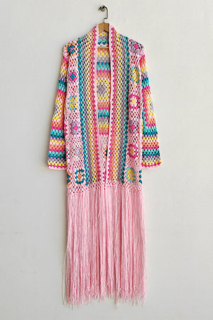 Crochet duster with granny squares, multicolor stripes, and pink fringe.