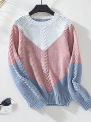 Chevron cable knit sweater in pastel blue, blush pink, and white with cable knit detail.
