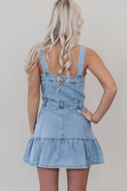 Button-front denim sundress in medium wash with a ruffle hem and adjustable straps.