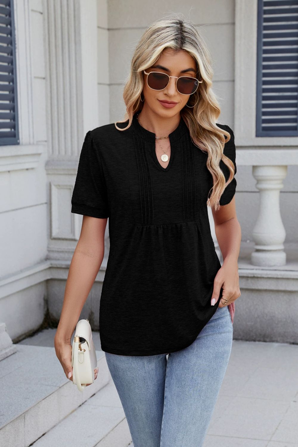 Black short sleeve tee with pleated yoke and keyhole neckline