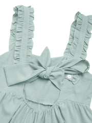 Light green ruffled strap romper with a large bow back detail and button closure.