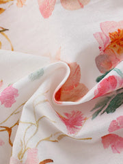 Toddler dress in cotton blend with pink and orange floral print and ruffle detail.