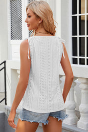 White eyelet button-down tank top with tie shoulders and a square neckline.