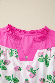 Strawberry print cotton blend blouse with color block pink top and ruffled neckline.