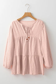 Watermelon pink textured tiered blouse with tie detail and beaded accents.