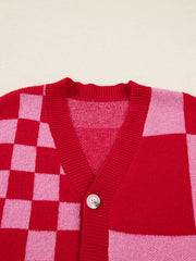 Checkerboard knit cardigan in deep rose with a V-neck and button closure.