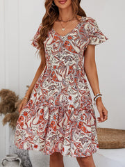 Paisley print mini dress with flutter sleeves and V-neck in cream/orange.
