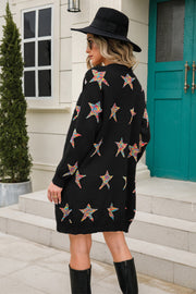 Black knit cardigan with colorful embroidered starburst pattern, long sleeves, and open front.