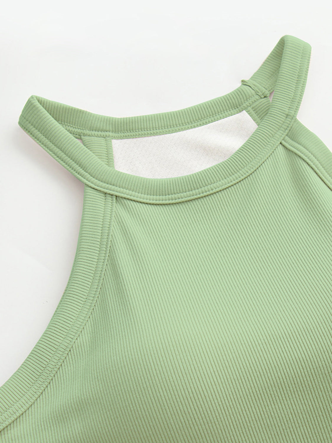 Ribbed halter tank top in Gum Leaf green with built-in bra detail.
