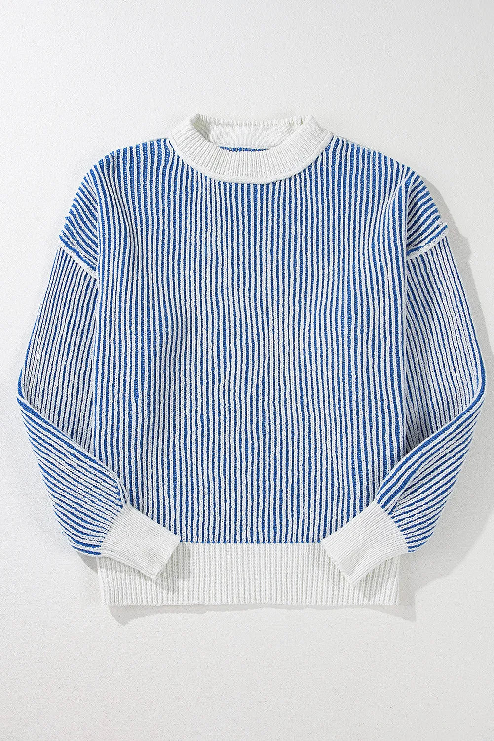 Light blue and white striped knit drop-shoulder sweater with crew neck and ribbed cuffs.