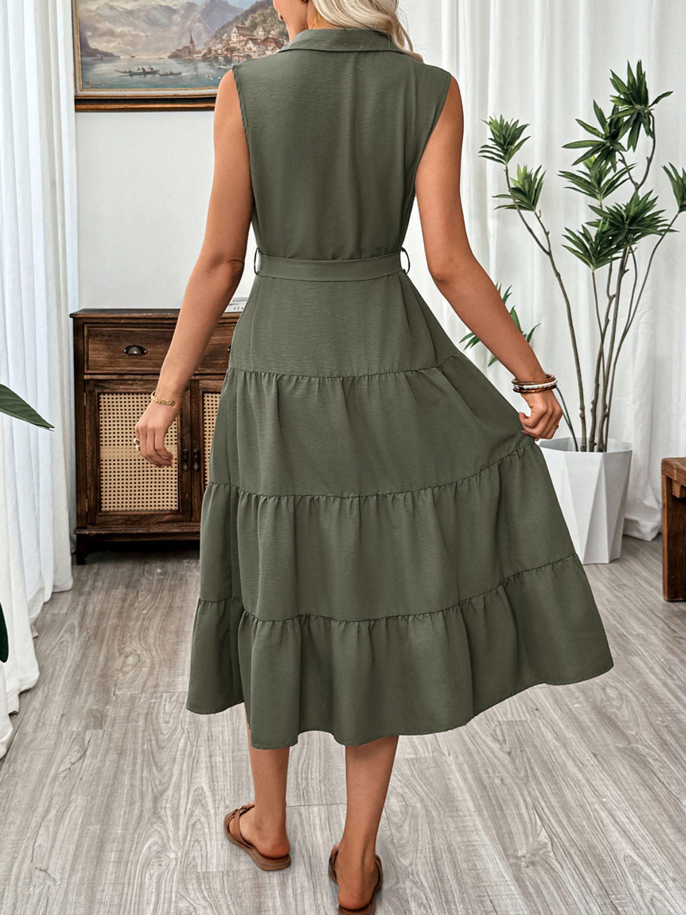 Sleeveless olive green button-down midi dress with tiered skirt and belt