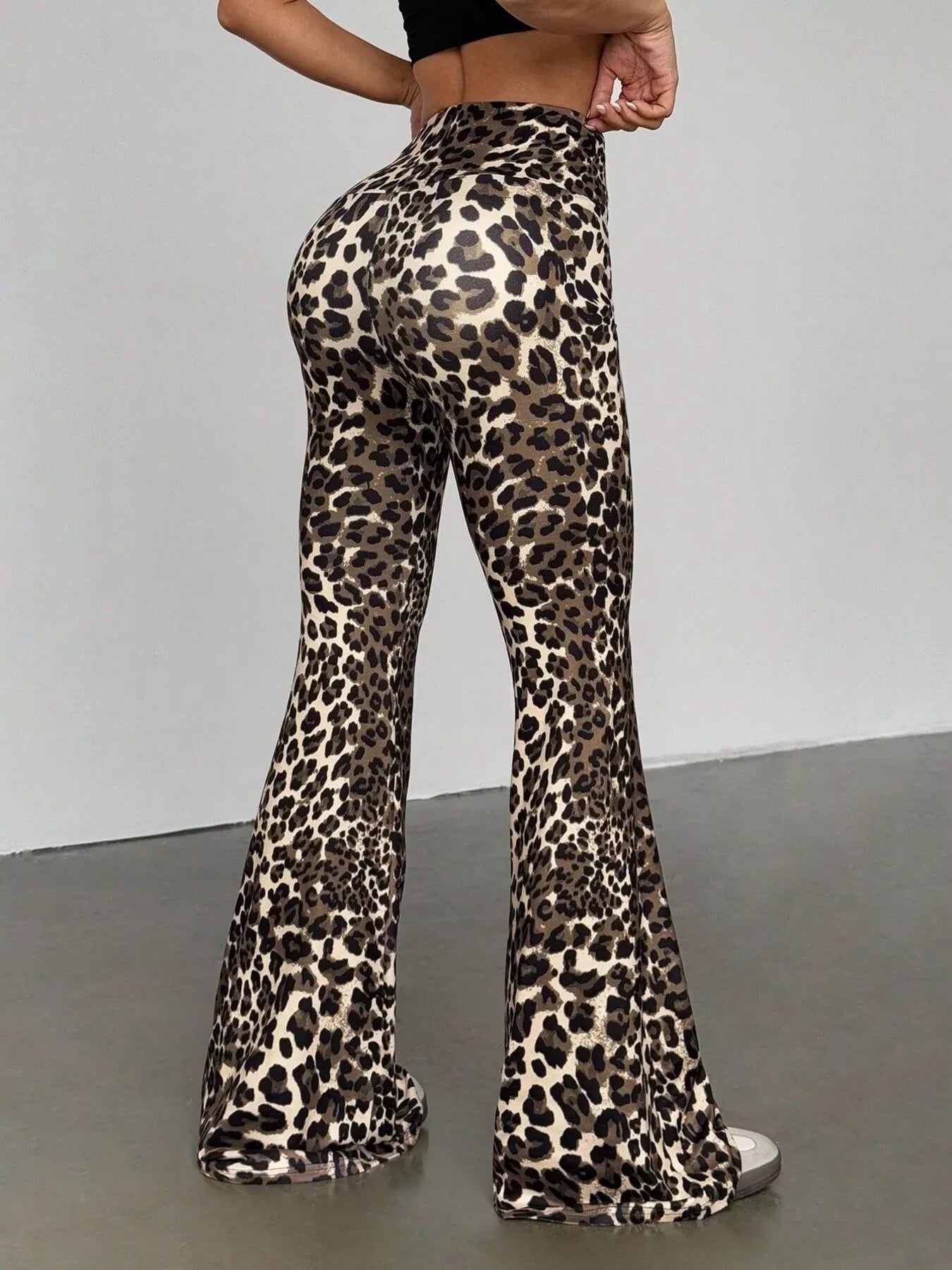 Leopard print high-waist flare pants in red with a comfortable fit.