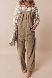 Camel corduroy wide-leg overalls with a bib front and adjustable straps.