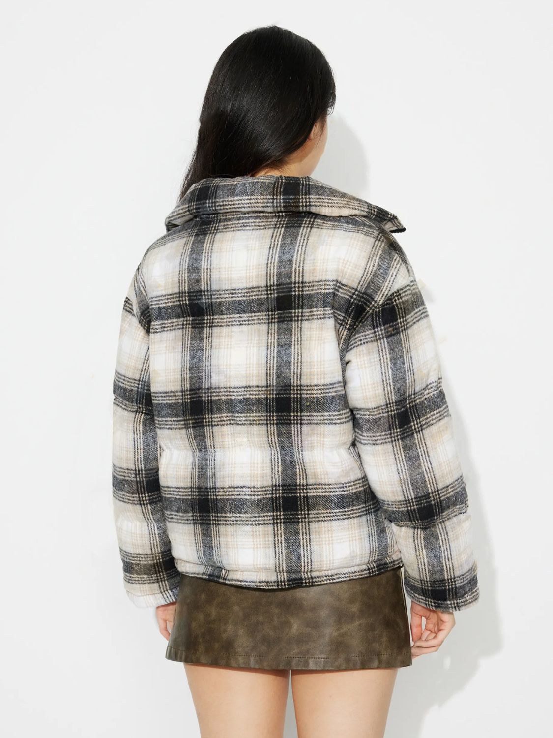 Plaid puffer jacket with a cozy collar in gray and black plaid.