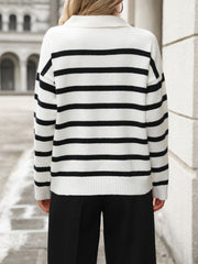 Striped polo-neck knit pullover sweater in white with black horizontal stripes and ribbed cuffs.