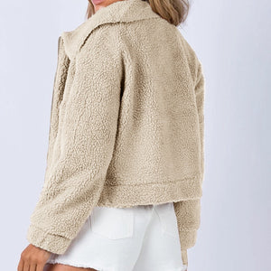 Sand textured sherpa cropped jacket with a collared neckline and zipper closure.