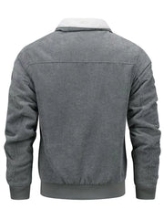 Men's gray corduroy bomber jacket with sherpa collar and ribbed cuffs and hem.