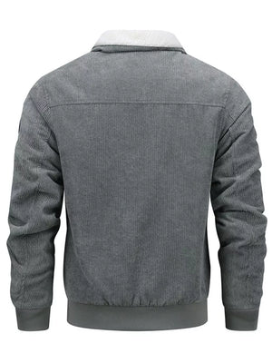 Men's gray corduroy bomber jacket with sherpa collar and ribbed cuffs and hem.