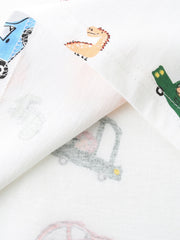 White cotton t-shirt for kids with cartoon dinosaurs, cars, and trucks print.