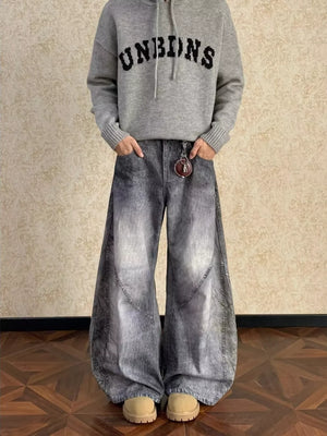 Men's vintage wash wide leg jeans in grey denim with curved seams and a full size fit.