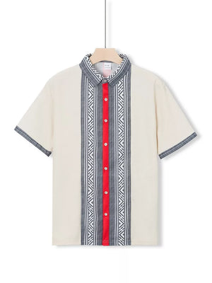 Men's short sleeve shirt in off-white with bold geometric print panel and red placket.