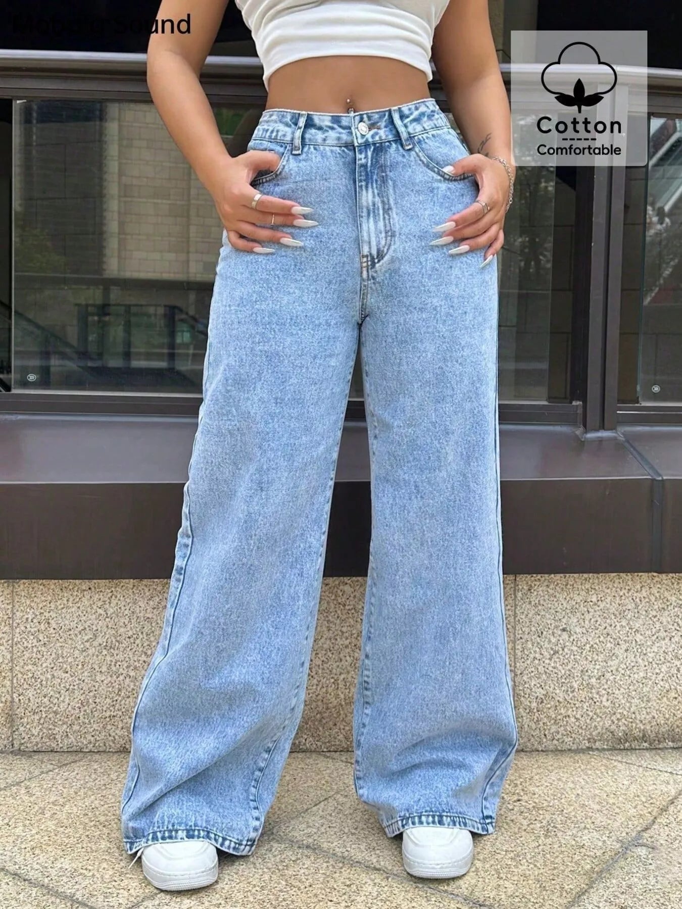 Wide-leg blue denim jeans with pockets and a comfortable cotton blend.