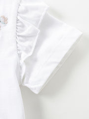 White toddler dress with embroidered butterfly detail and ruffled sleeves.