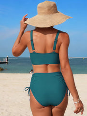 Teal high-waisted bikini bottoms with drawstring sides and a matching bikini top.