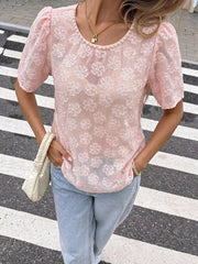 Pink embroidered floral sheer blouse with pearl trim and puff sleeves.