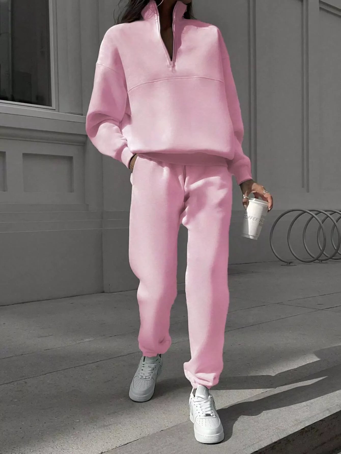 Blush pink half zip sweatshirt and matching pants set, casual athleisure outfit.