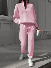 Blush pink half zip sweatshirt and matching pants set, casual athleisure outfit.