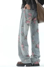 Floral print wide-leg maternity jeans in light wash denim with pink floral pattern.