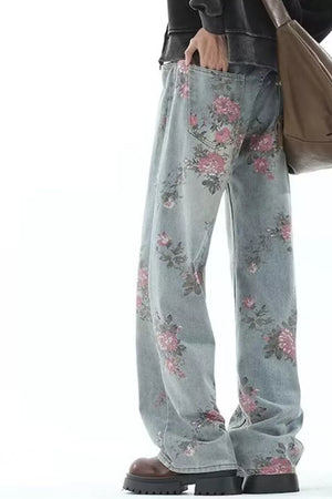 Floral print wide-leg maternity jeans in light wash denim with pink floral pattern.