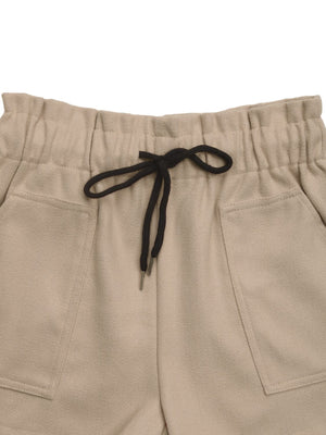 Tan paperbag waist utility shorts with drawstring and front pockets.