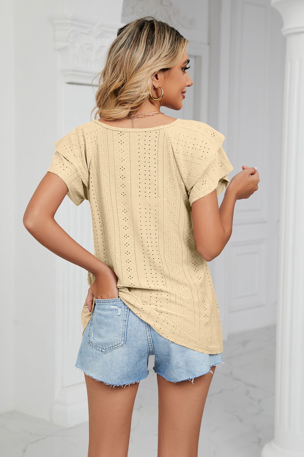 Light Yellow eyelet knit blouse with flutter sleeves and V-neck, shown from the back.